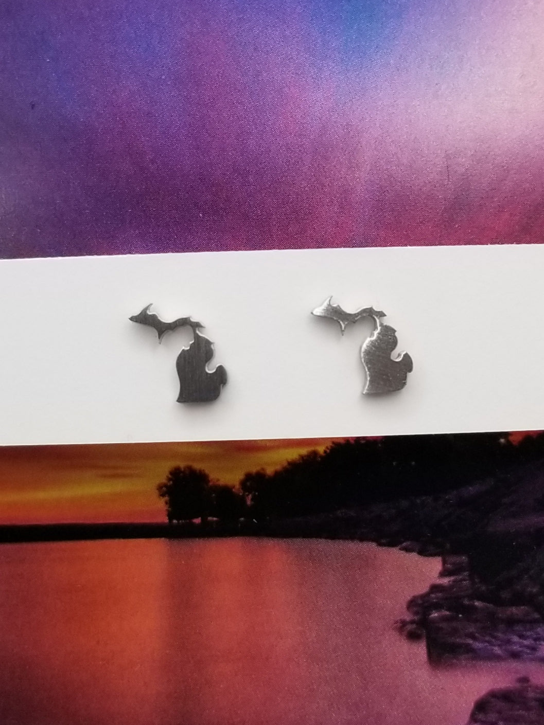 Mini stud earrings with combined upper and lower peninsulas of Michigan. Sterling silver and made in Traverse City.