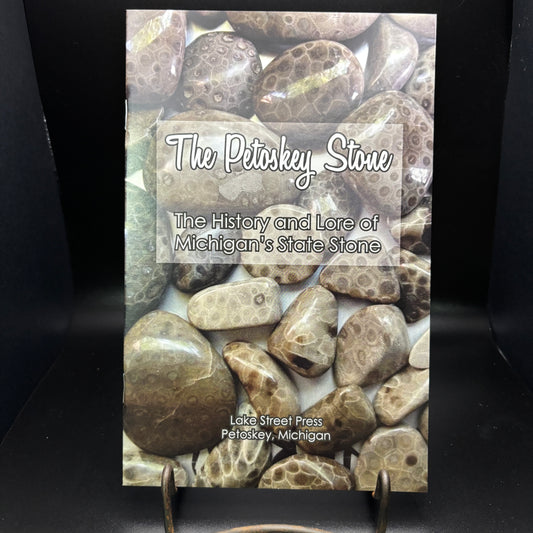Book titled 'The Petoskey Stone' with stone imagery on a black background