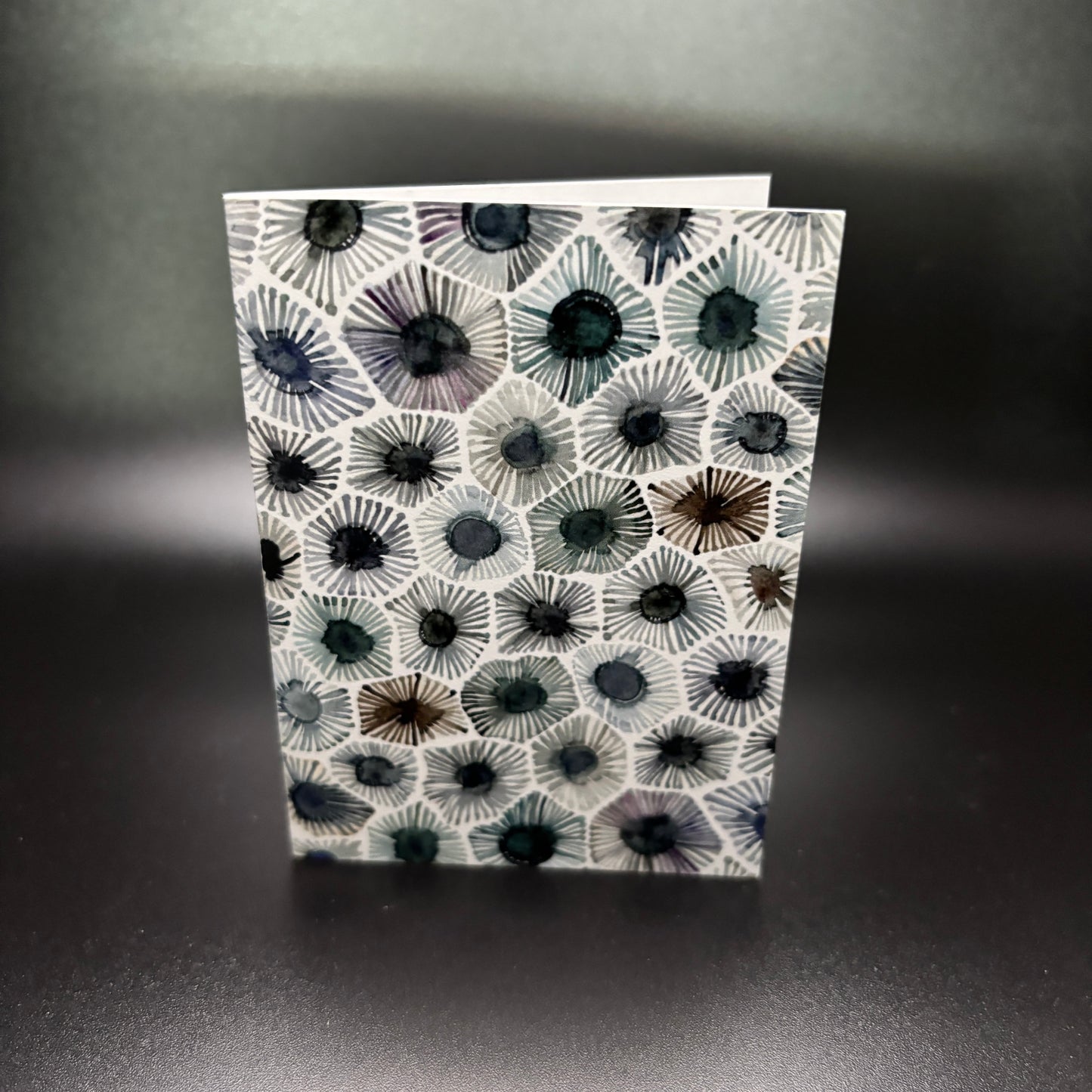 Petoskey Stone Watercolor Enclosure Card with a petoskey stone pattern 2.5 by 3.5 inches on a dark background