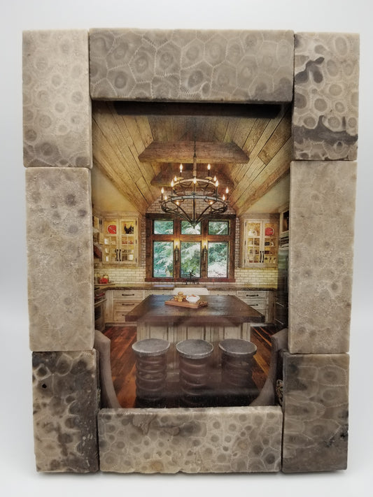 Image of a 4x6 picture frame with long rectable petoskey stone slabs around the glass. Image inside the frame is of a nice wooden home kitchen. Display your own memories inside!